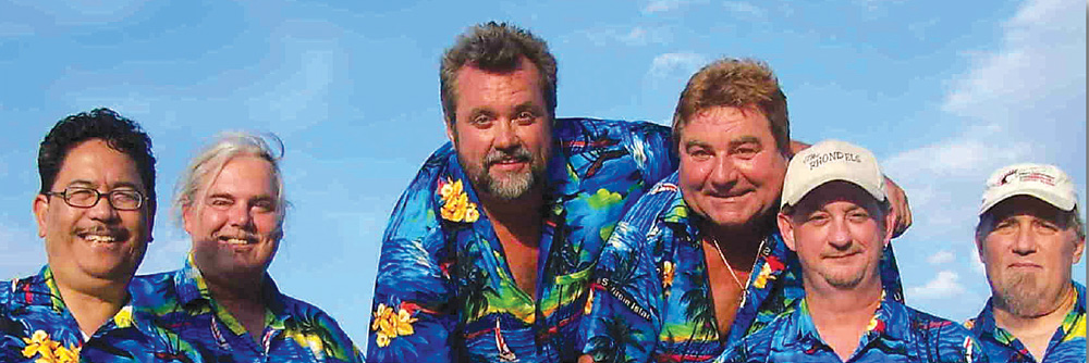 The Rhondels group image wearing Hawaiin shirts