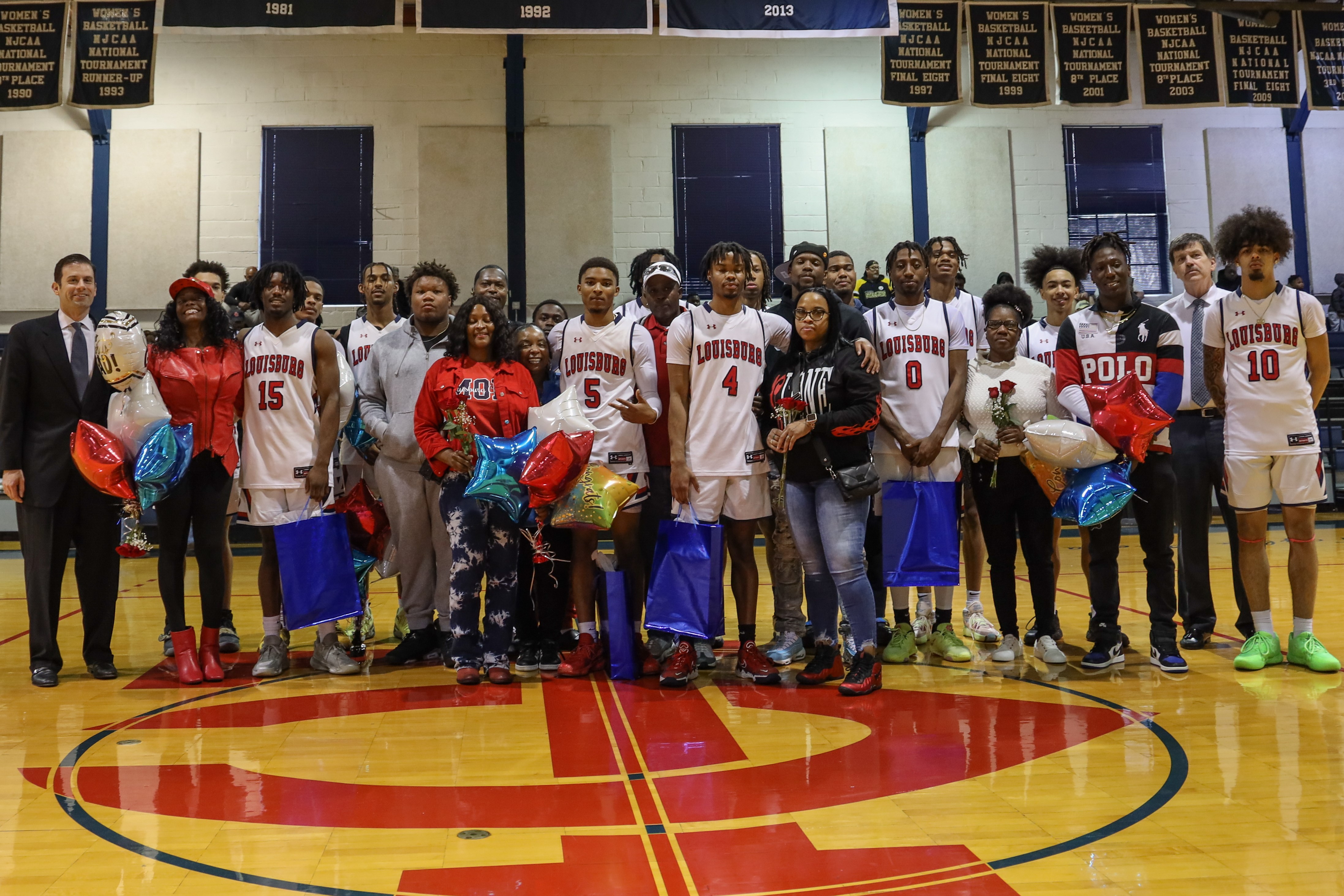 Louisburg College's Mens basketball team with friends and family.