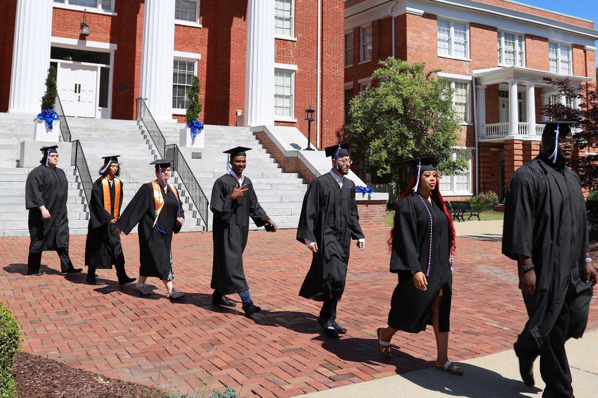 Louisburg College students walking from Main to Commencement Ceremony.