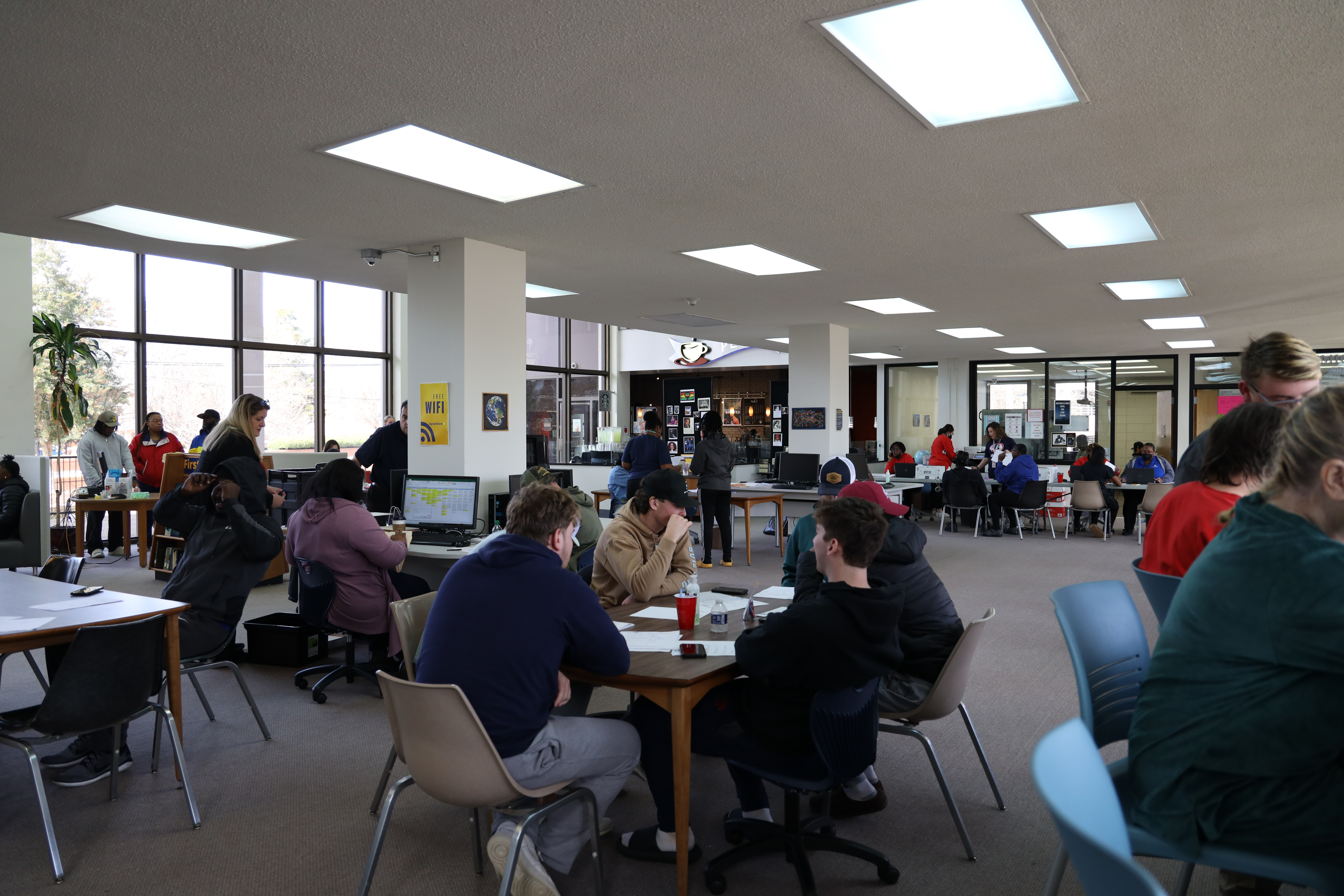 Students in the Louisburg College library during check-in.