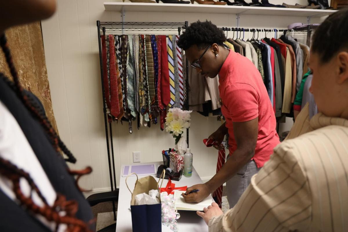 Student receives item from Polished and Prepared Closet