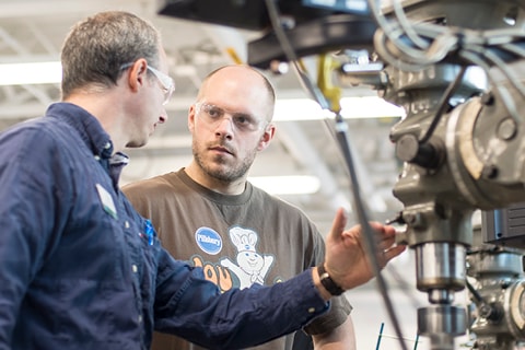 Student and Teacher at CNC Machine