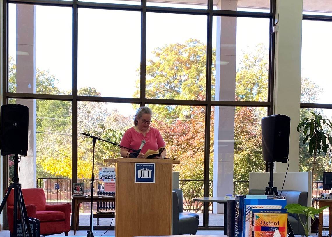 Professor Reads in Library